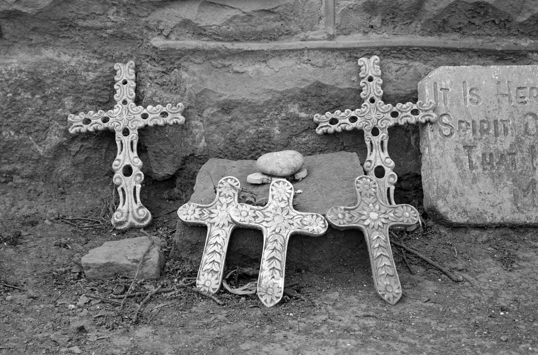 religious crosses and headstone in cemetery scene